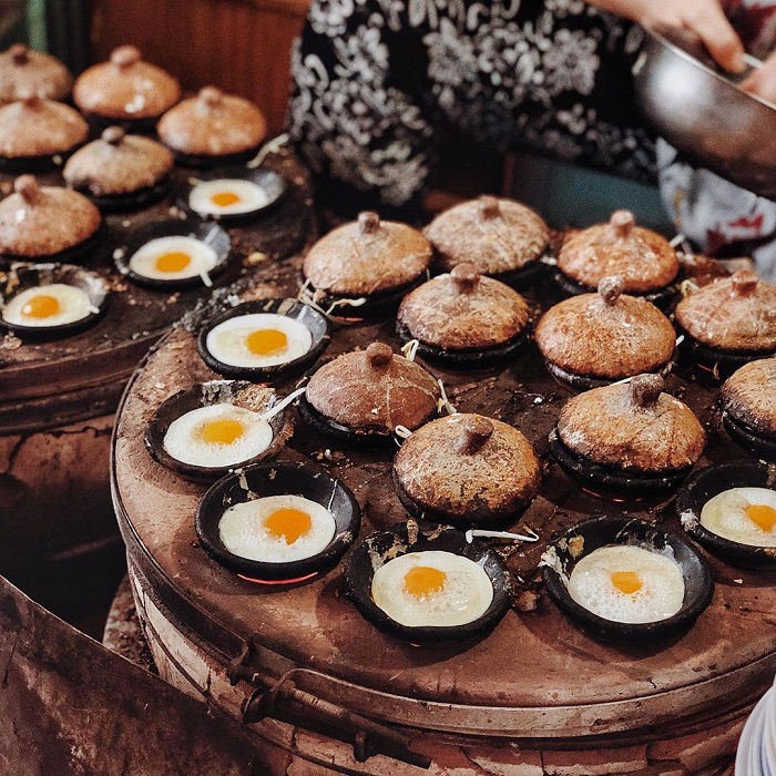 Banh Can cooking on clay stoves