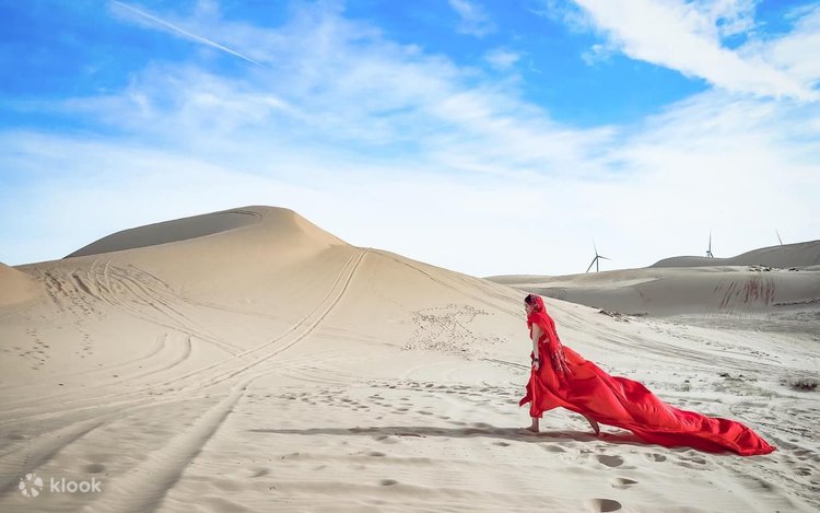 Panoramic view of white sand dunes in the afternoon with jeep shadows on the sand.