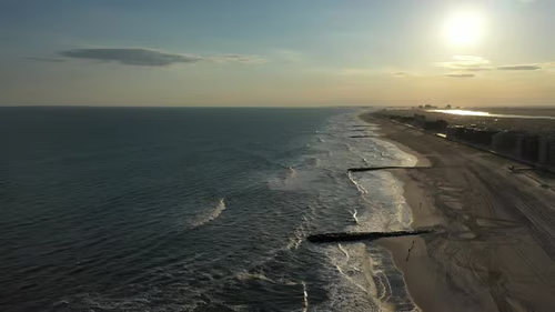 Wide-angle shot of Hai Hoa Beach with empty shoreline