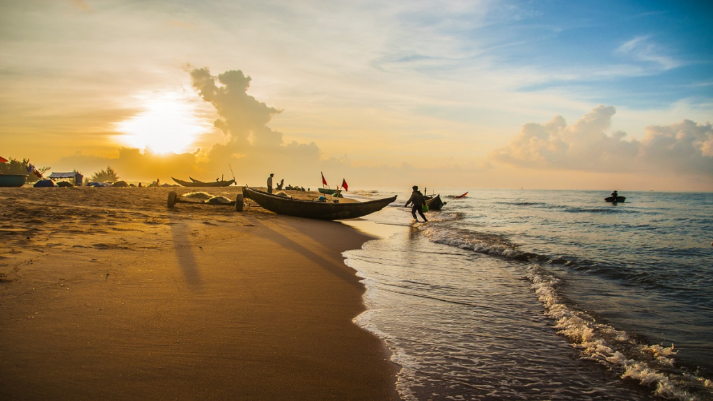 Sunrise over Cua Viet Beach with fishing boats